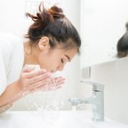 A Woman Washing Her Face