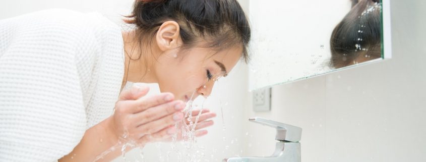A Woman Washing Her Face