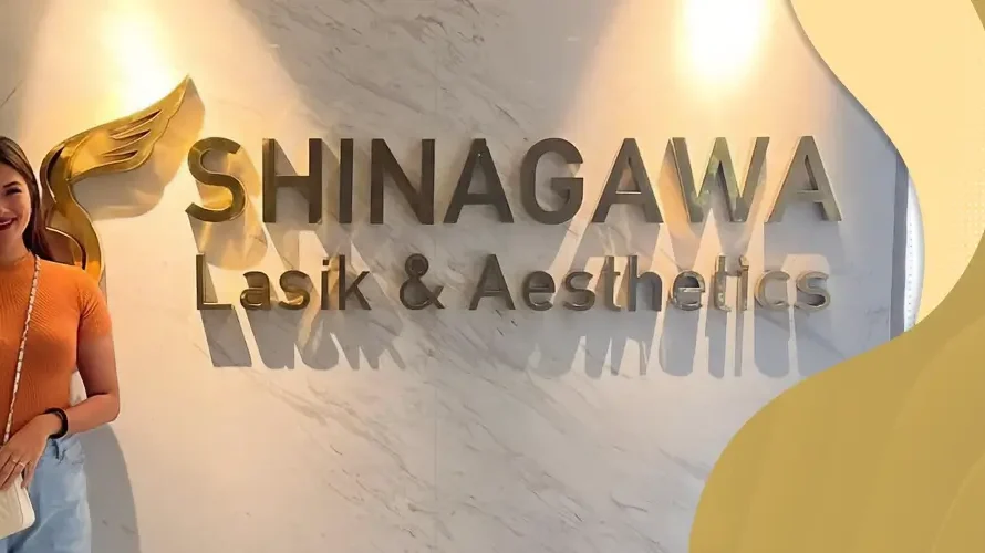 Amabee Marfa posing at the Shinagawa Lasik & Aesthetics clinic entrance in the Philippines
