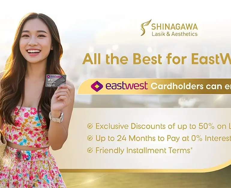 Smiling woman holding EastWest credit card promoting LASIK discounts at Shinagawa Lasik & Aesthetics in the Philippines
