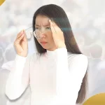 Woman struggling with blurry vision in crowded street, adjusting glasses due to poor eyesight, representing common eye conditions treated by Shinagawa Lasik & Aesthetics Philippines
