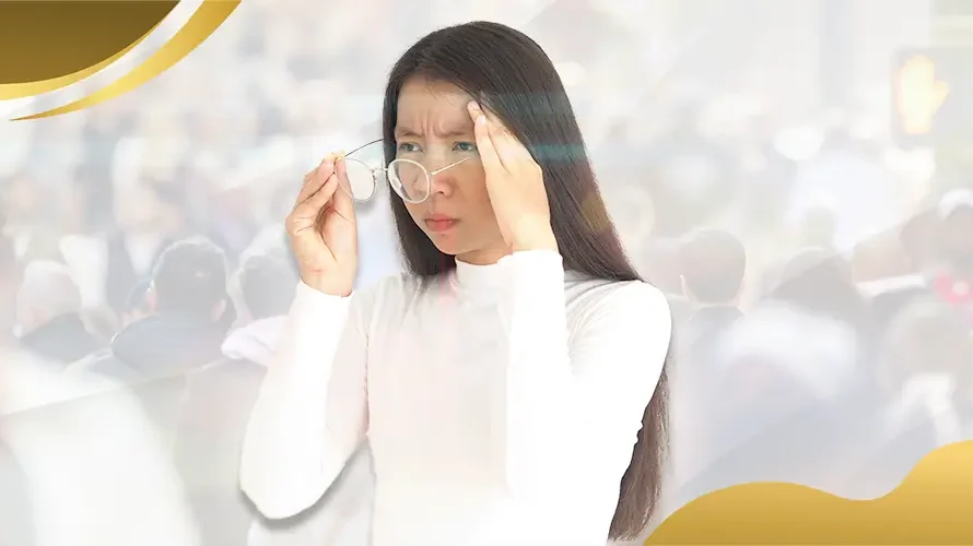 Woman struggling with blurry vision in crowded street, adjusting glasses due to poor eyesight, representing common eye conditions treated by Shinagawa Lasik & Aesthetics Philippines