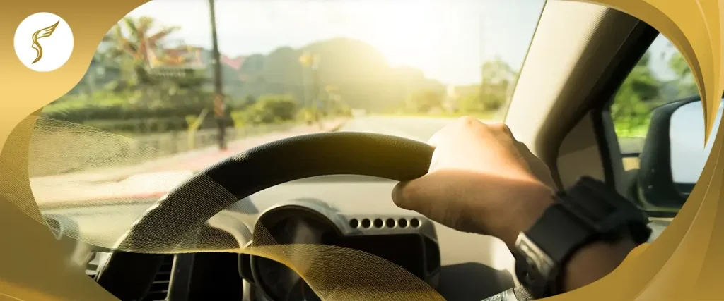 Driver’s view of a bright sunny road, illustrating glare sensitivity and vision challenges while driving with eye conditions like keratoconus