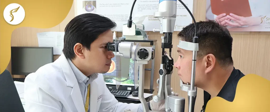 Ophthalmologist performing a comprehensive eye exam using a slit lamp during a LASIK screening consultation.