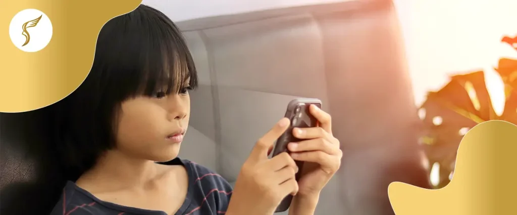 Child using a smartphone, highlighting screen time and eye health risks.