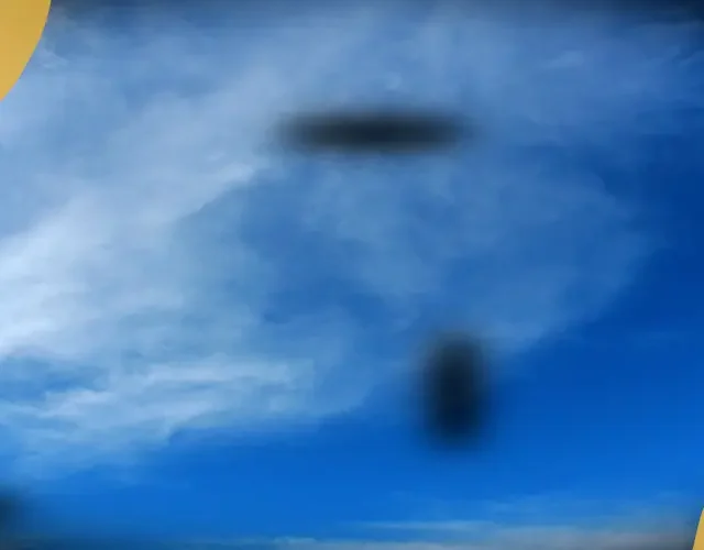 Simulation of eye floaters appearing as dark spots and shadows against a bright blue sky, representing visual disturbances commonly experienced by patients.