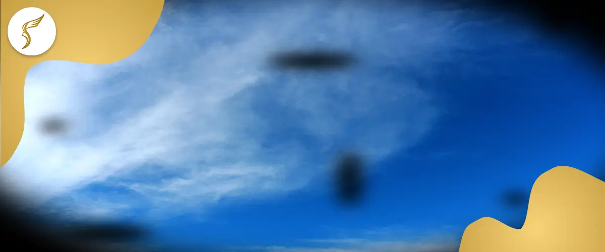 Simulation of eye floaters appearing as dark spots and shadows against a bright blue sky, representing visual disturbances commonly experienced by patients.