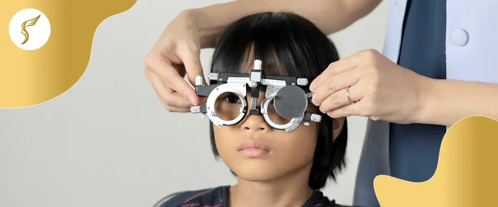 Child undergoing pediatric eye exam with phoropter vision test.